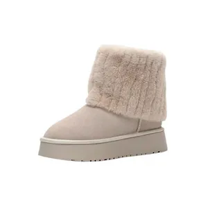 Side detail view of winter thick-sole snow boots with soft beige faux fur trim