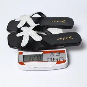 Vista detallada de chanclas de playa para mujer con estrella de mar, peso 227,8g