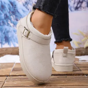Detail view of women's warm beige platform snow boots with buckle and fur lining