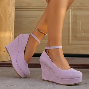 Light purple suede wedge heels with ankle straps and round toe platform design