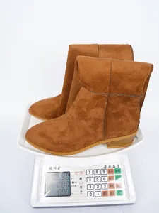 Functional detail view of brown suede knee-high boots with chunky heel weighing 0.530kg