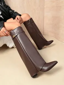 Chic dark brown pointed-toe pant-leg boots with decorative metal buckle strap