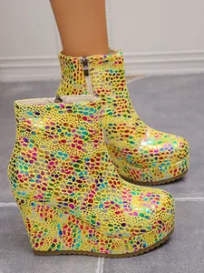 Vibrant yellow platform wedge ankle boots with colorful pebble pattern and side zipper