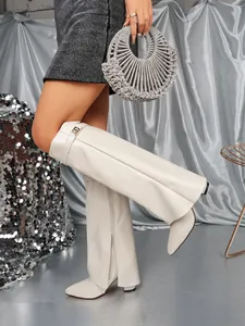 Stylish off-white pointed toe high heel pant boots with side zipper for winter fashion.