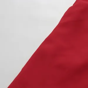 Detailed macro shot of the high-quality red fabric texture for this elegant dress
