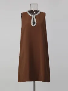 Elegant brown sleeveless short dress with luxurious rhinestone collar and keyhole detail
