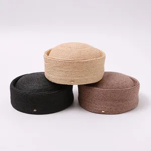 Detailed studio shot of three colors of premium hand-woven raffia boater hats for women