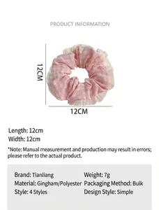 Detailed view of pink checkered hair scrunchie with lace trim and 12cm size info