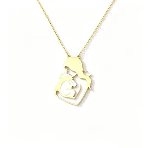 Detailed close-up of a gold-plated necklace featuring a mother and child pendant design