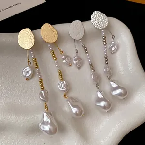 Vintage gold and silver wrinkled metal drop earrings with elegant baroque pearls