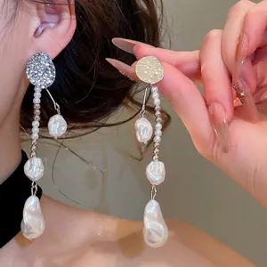 Elegant vintage wrinkled metal drop earrings with irregular white baroque pearls