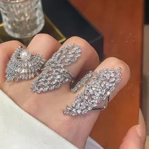 Dazzling silver geometric rings set with sparkling cubic zirconia and a pearl detail