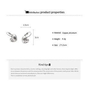 Detail view of silver heart earrings with dimensions and material specs