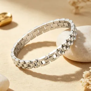 Macro view of a unisex stainless steel watch link bracelet with a polished silver finish