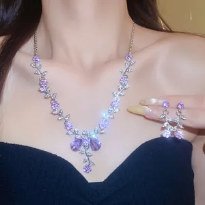 Detailed view of elegant purple flower rhinestone necklace and matching earrings set