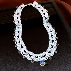Elegant light blue beaded lace style necklace featuring clear crystal teardrop accents for women