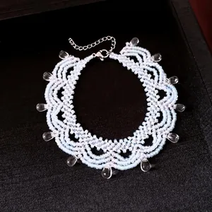 Elegant light blue beaded lace necklace with teardrop charms and stainless chain