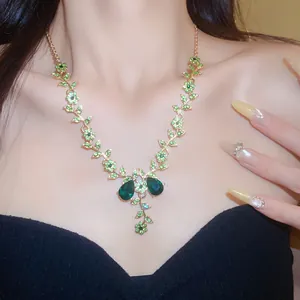 Close-up of elegant green crystal floral necklace on model for bridal wedding jewelry