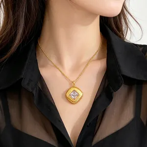 Elegant gold twisted square pendant necklace featuring a clear square zircon detail