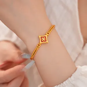 Bracciale vintage placcato oro 24K con fiore in smalto rosso e dettaglio in zircone