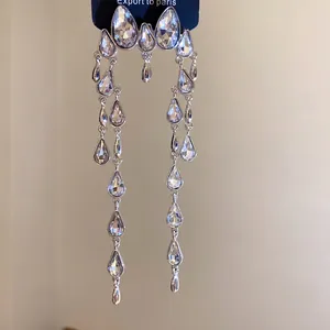 Close-up of elegant water drop long tassel earrings featuring sparkling crystal rhinestones