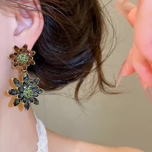Detailed close-up of vintage luxury double-layer flower earrings with sparkling rhinestones