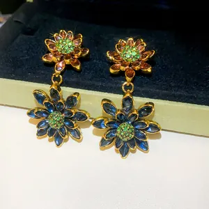 Detailed view of vintage double-layer floral earrings with navy blue and copper petals