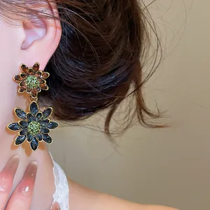 Detailed close-up view of vintage double-layered flower earrings with colorful rhinestones