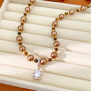 Elegant brown pearl and tiger eye stone beaded necklace featuring a sparkling square zircon pendant
