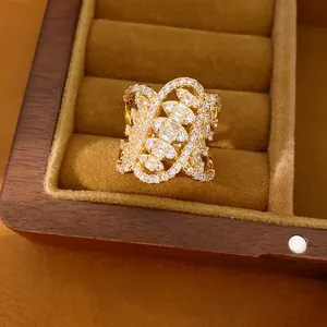 Close-up detail of a vintage palace style gold ring with twisted geometric zircon design