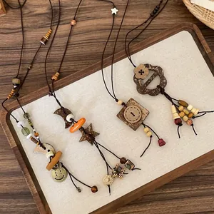 Detailed view of retro ethnic beaded necklaces with star moon and wood charms