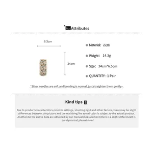 Specifications showing size and material for this sweet floral knit fringe hair sticker.