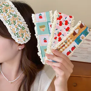 Macro view of cute floral knit hair velcro bands featuring various patterns and lace