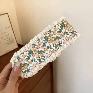 Detail of sweet floral pattern hair sticker with white lace trim for styling fringe
