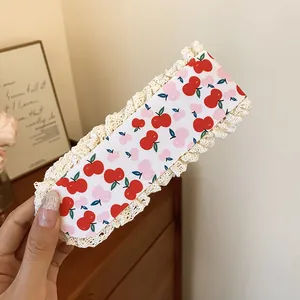 Close-up of sweet cherry and floral pattern knit bangs patch with delicate lace trim