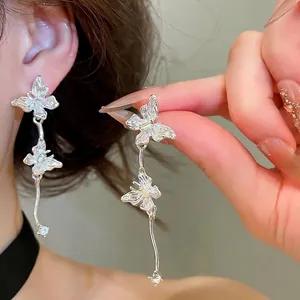 Elegant silver-toned butterfly tassel drop earrings with sparkling rhinestones for women