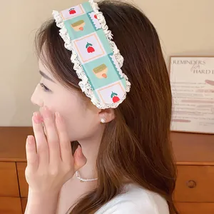 Close-up of a sweet floral knitted fringe hair sticker with lace trim on a model