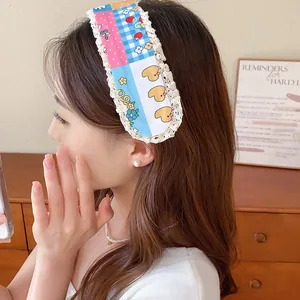 Close-up of a sweet floral knit fringe hair patch with lace edges worn by an Asian model