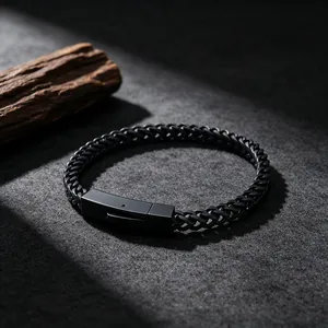 Detailed view of a matte black stainless steel wheat chain bracelet with square clasp