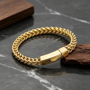 Detailed macro shot of gold-plated stainless steel Franco chain bracelet with secure box clasp