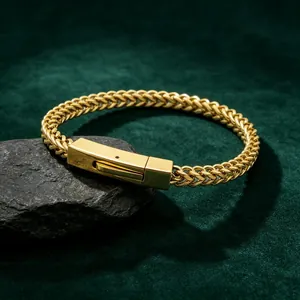 Detailed view of a gold stainless steel dragon bone chain bracelet with a modern square clasp