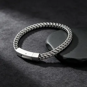 Detailed view of silver stainless steel dragon bone chain bracelet with square insert clasp.