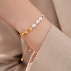 Detailed close-up of a vintage gold and silver oval textured sliding bracelet on a wrist