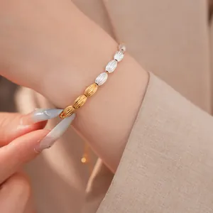 Close-up of two-tone gold and silver oval textured links on vintage style bracelet
