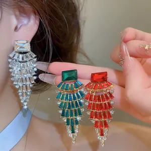 Detailed view of glamorous fan-shaped rhinestone chandelier earrings in multiple colors
