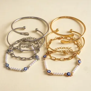 Set di 4 bracciali stile vintage con ciondoli malocchio perle e bracciali oro e argento