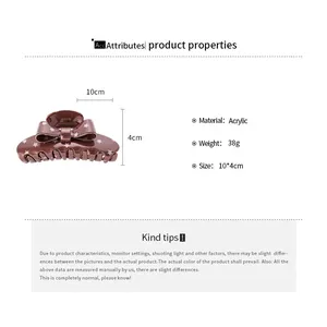 Detailed specification view of brown acrylic butterfly bow hair claw clip with stars