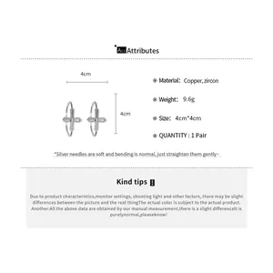 Spécifications détaillées des créoles croix en zircon, diamètre 4cm et infos matériaux.
