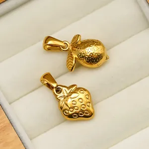 Detail of 18K gold plated stainless steel strawberry and lemon fruit jewelry pendants