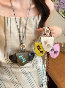 Colorful leather glasses holder necklaces with sun embroidery and braided rope cords.